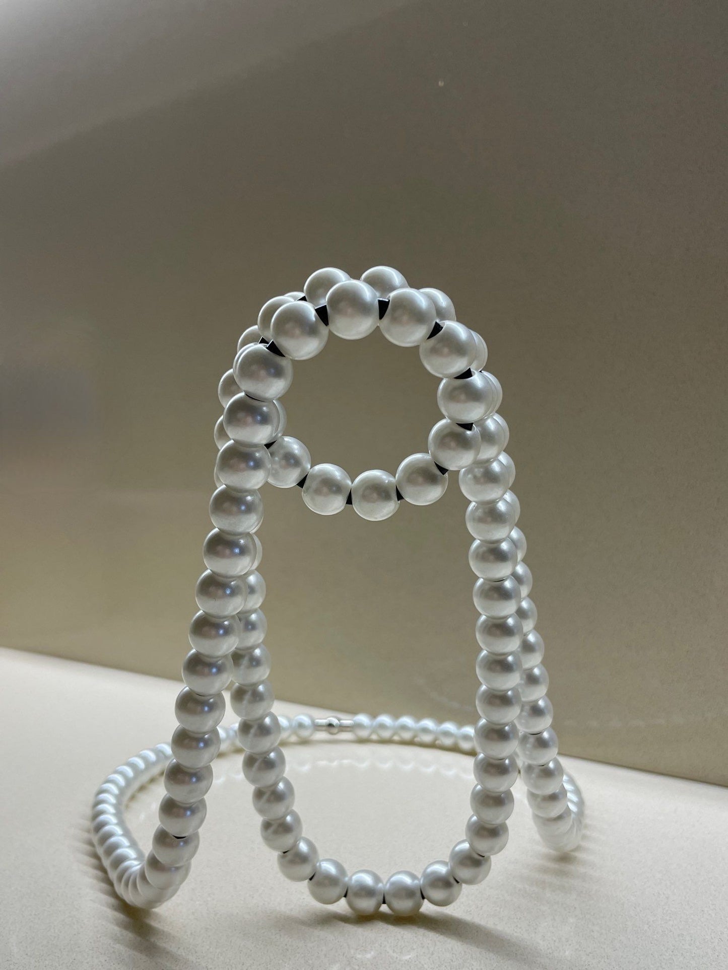 Floating Pearl Necklace Bottle Holder